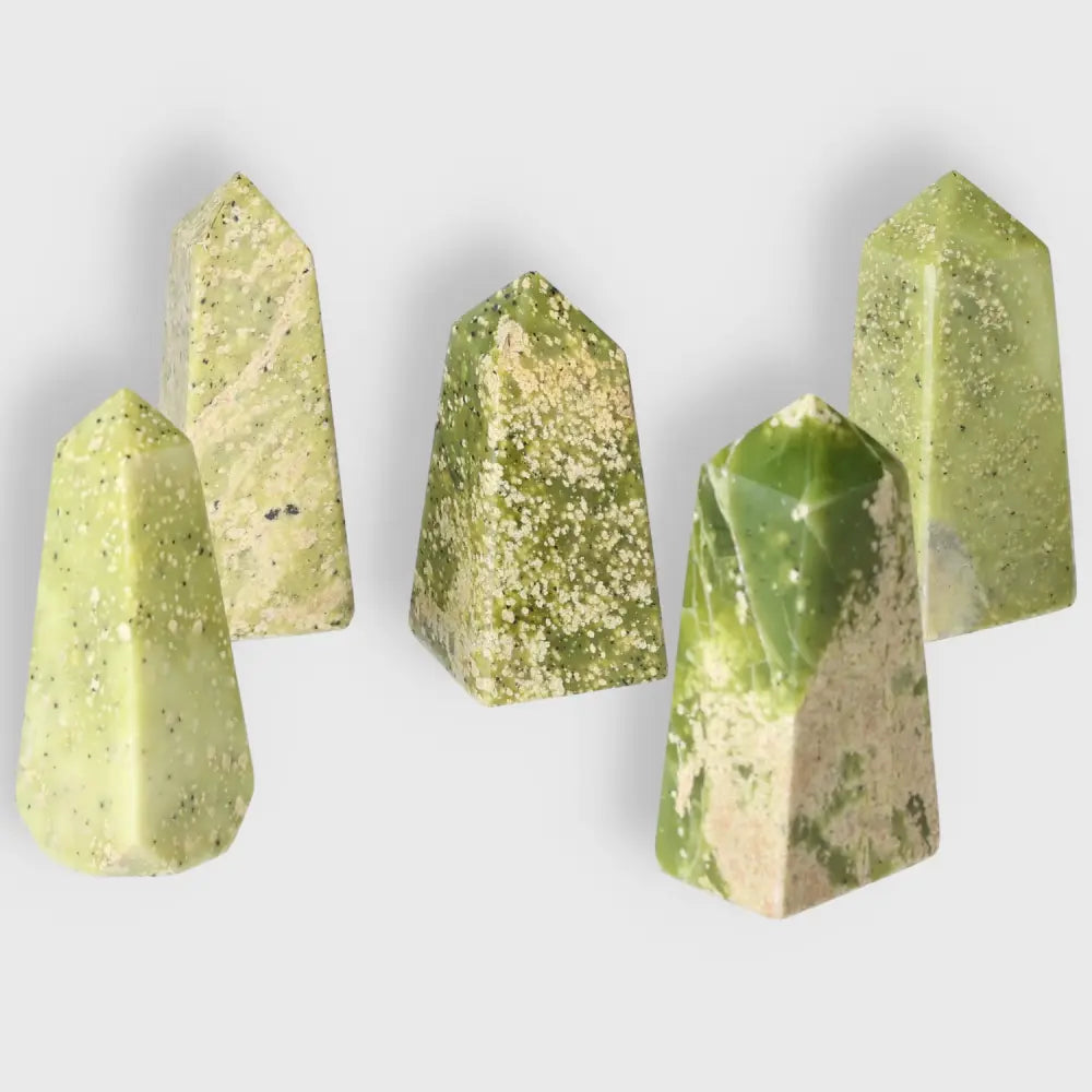 Collection of medium serpentine obelisks, showcasing unique green hues and natural patterns, ideal for spiritual growth and meditation.