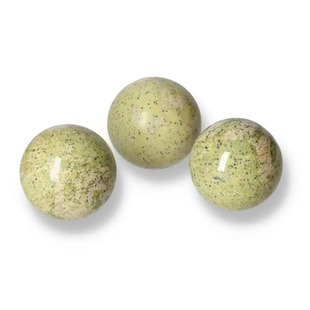 Three polished green Serpentine spheres ideal for meditation and décor, showcasing natural mineral patterns and grounding properties.