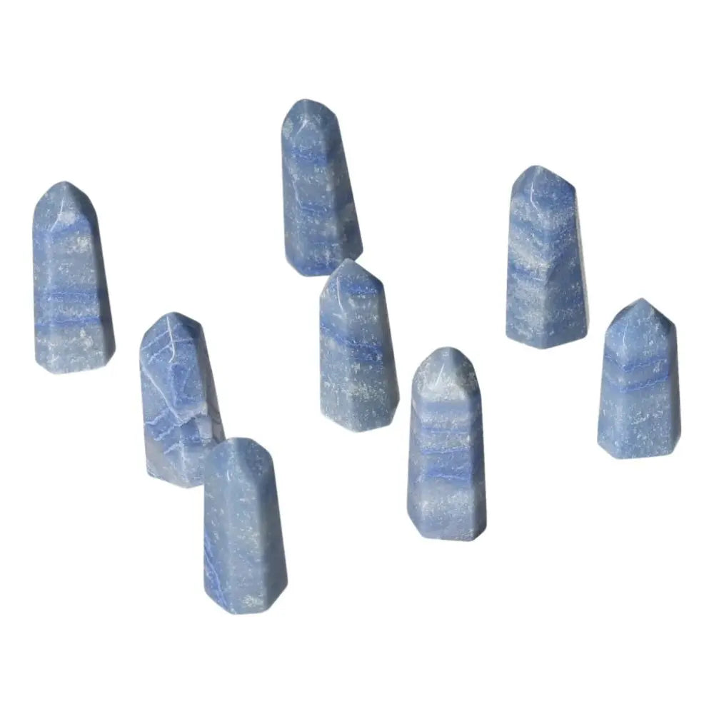 Mini Blue Quartz Points promoting calm, communication, and clarity, ideal for peace and focus; supports throat and third eye chakras.