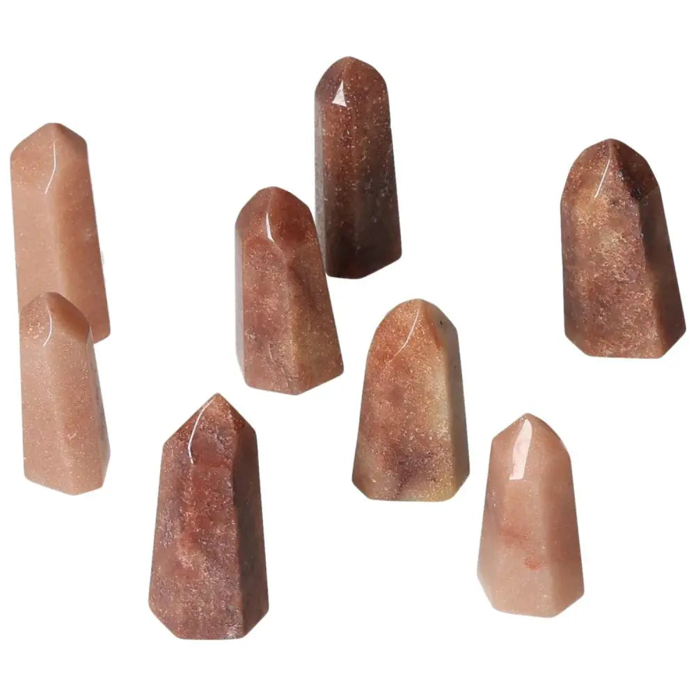 Mini Red Quartz points for vitality and courage, displaying natural hematite inclusions to enhance energy and emotional resilience.