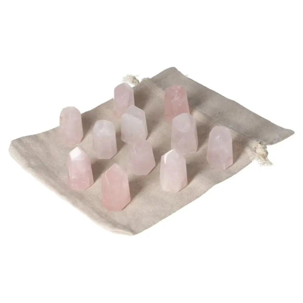 Mini Rose Quartz points on cloth, promoting love, compassion, and heart healing. Ideal for emotional balance and heart chakra support.