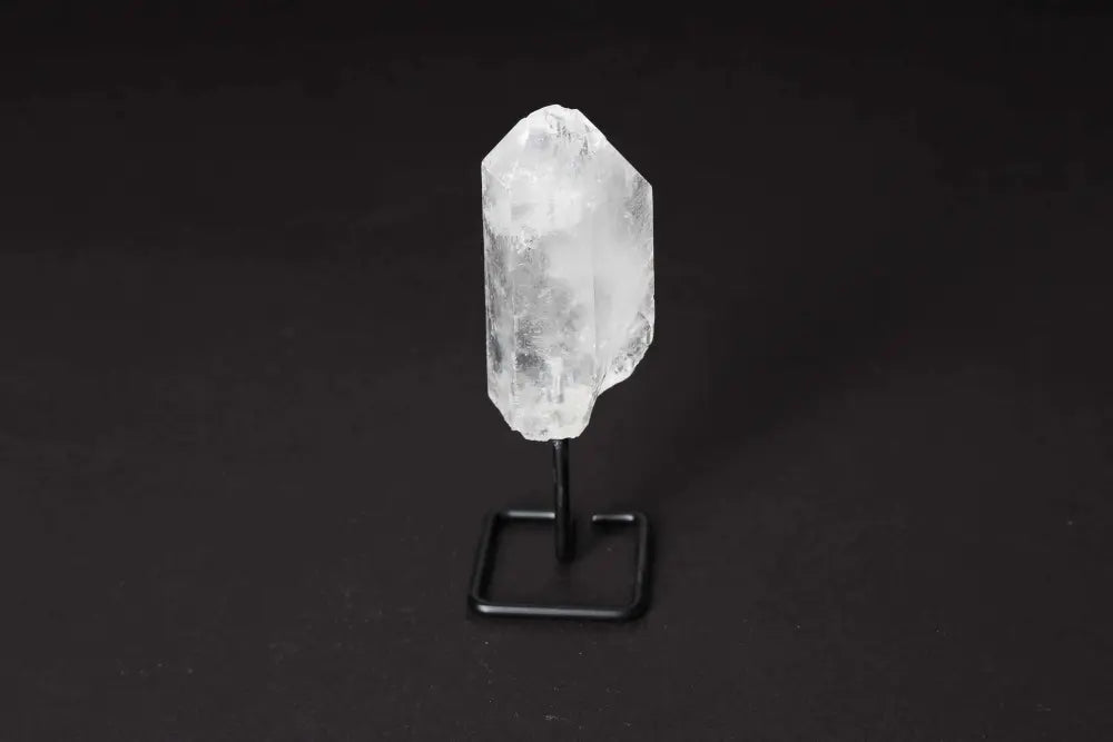 Natural Clear Quartz Point with stand for energy amplification, meditation, and clarity. Elegant and modern home decor centerpiece.