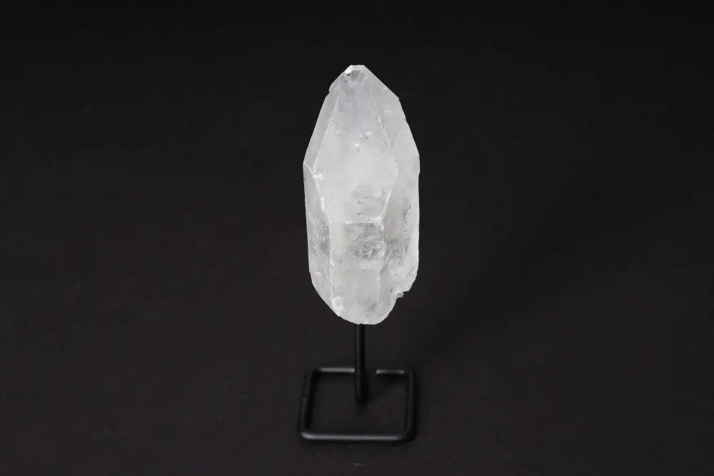 Clear Quartz Point on a modern stand, known as the Master Healer, ideal for meditation and energy work, amplifying clarity and intention.