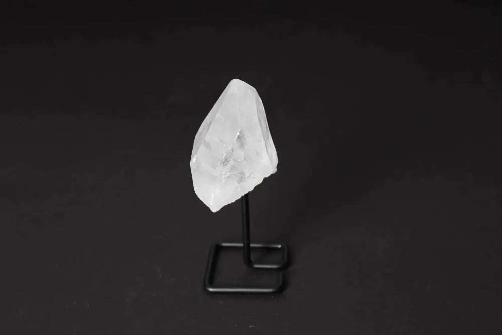 Natural Clear Quartz Point on Stand for energy amplification and clarity, ideal for meditation and manifesting spiritual alignment.