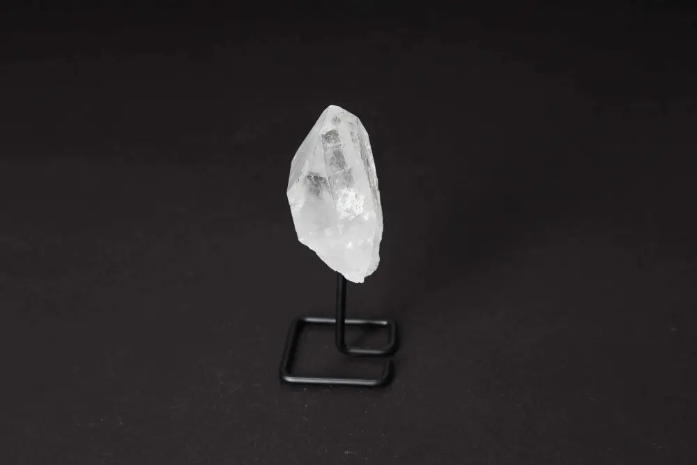 Clear Quartz Point with Stand for energy amplification and clarity, perfect for meditation and home decor elegance.