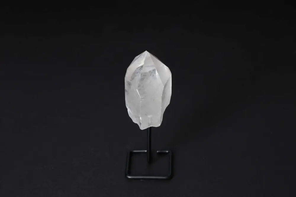 Clear Quartz Point with Stand for Energy Amplification and Clarity on Dark Background