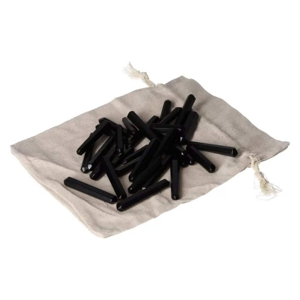 Obsidian Small Stics on a beige pouch for protection and negative energy absorption