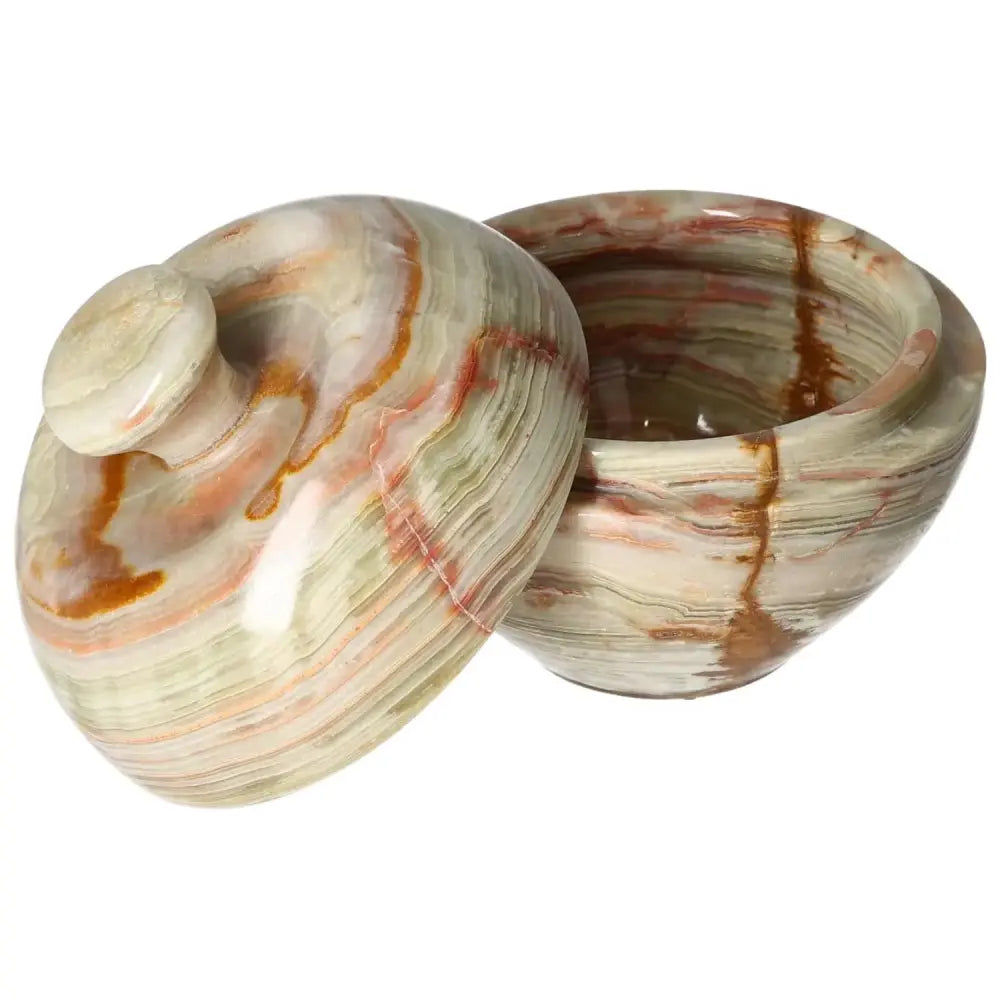 Onyx 10cm bowl with lid showcasing intricate veining and polished surface, perfect for adding elegance to home décor.