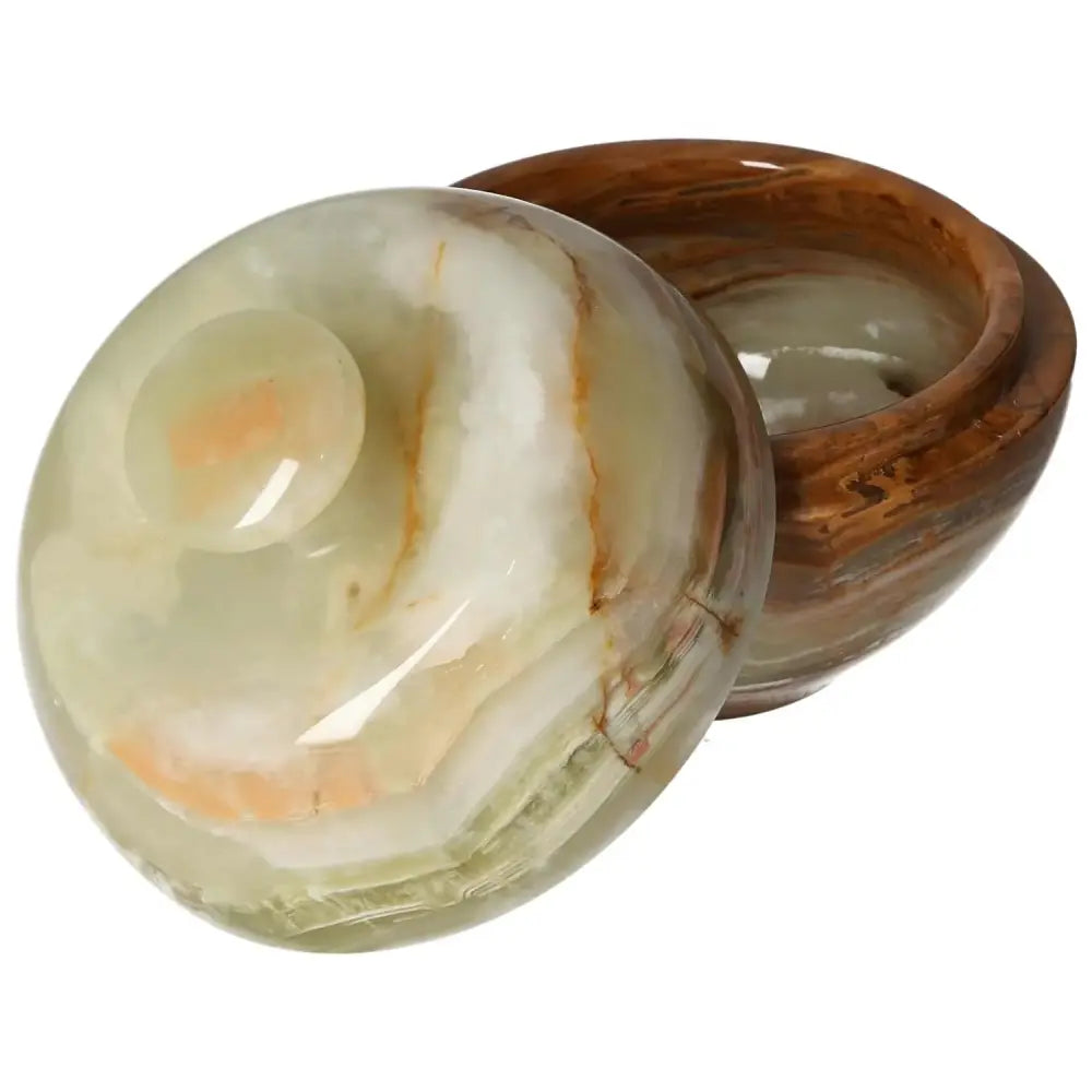 Onyx 10cm bowl with lid, showcasing polished surface and natural veining, perfect for adding elegance and sophistication to home décor.