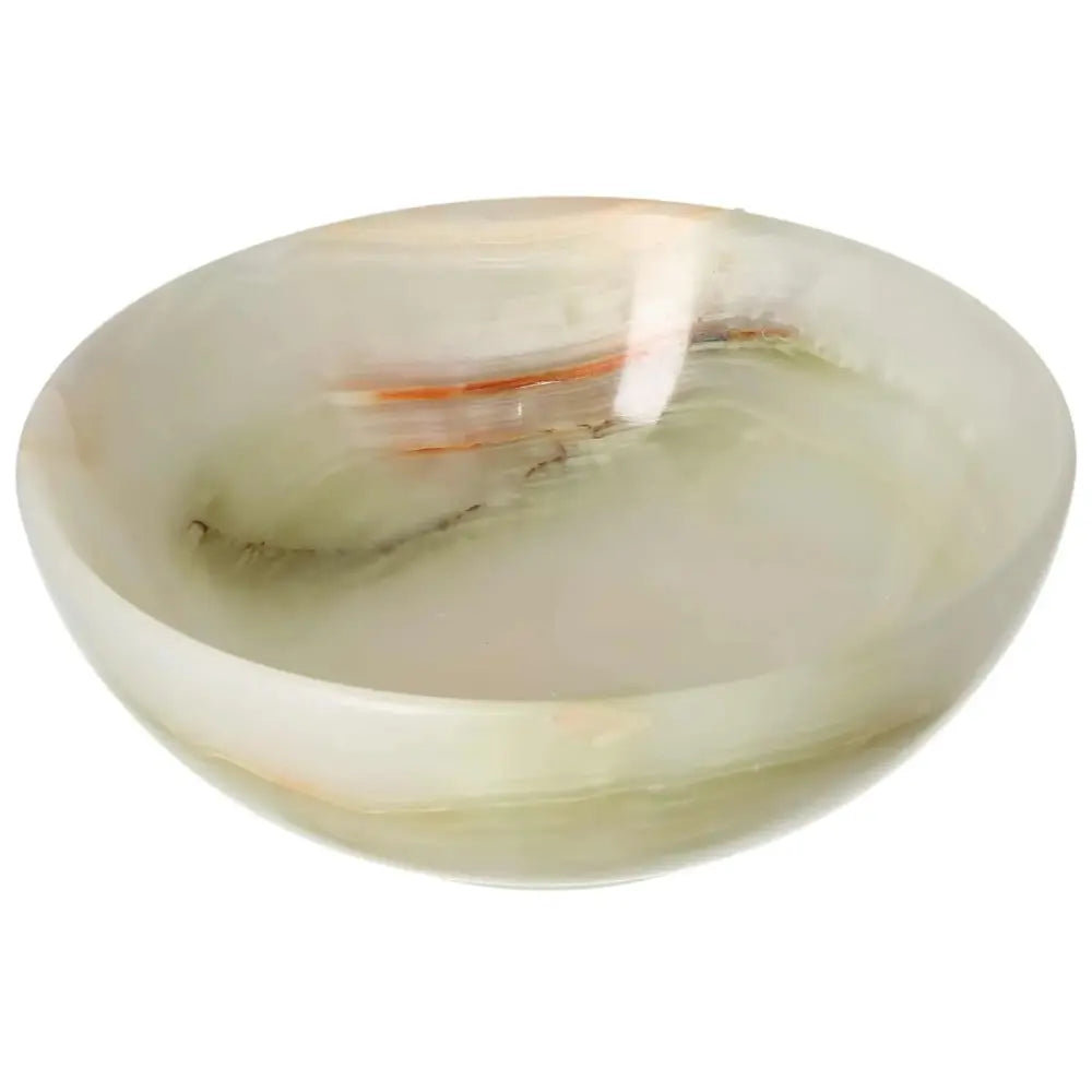 15 cm onyx bowl with smooth polished surface, showcasing delicate veining and organic color variations, adding elegance to interior decor.