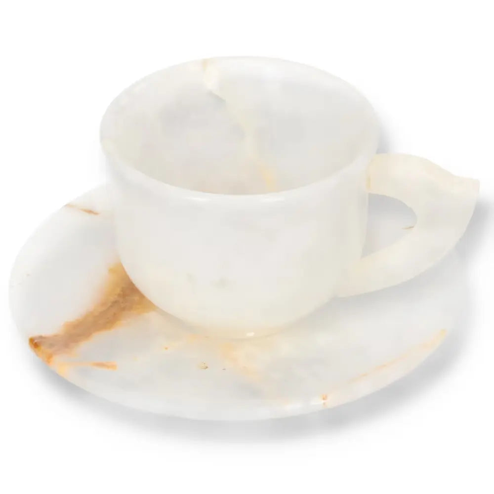 Elegant off-white onyx coffee cup and plate set showcasing natural tonal variations, perfect for elevating coffee rituals.