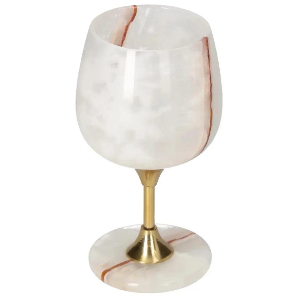 Exquisite off-white onyx wine glass with unique veining and polished surface, elegant design with a gold stem, enhancing sophisticated occasions.