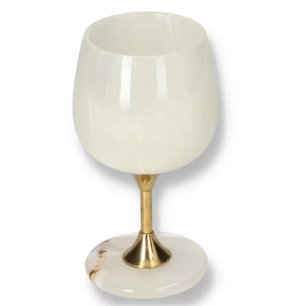 Luxurious off-white onyx wine glass with unique veining, featuring a polished surface and elegant gold stem, perfect for sophisticated occasions.