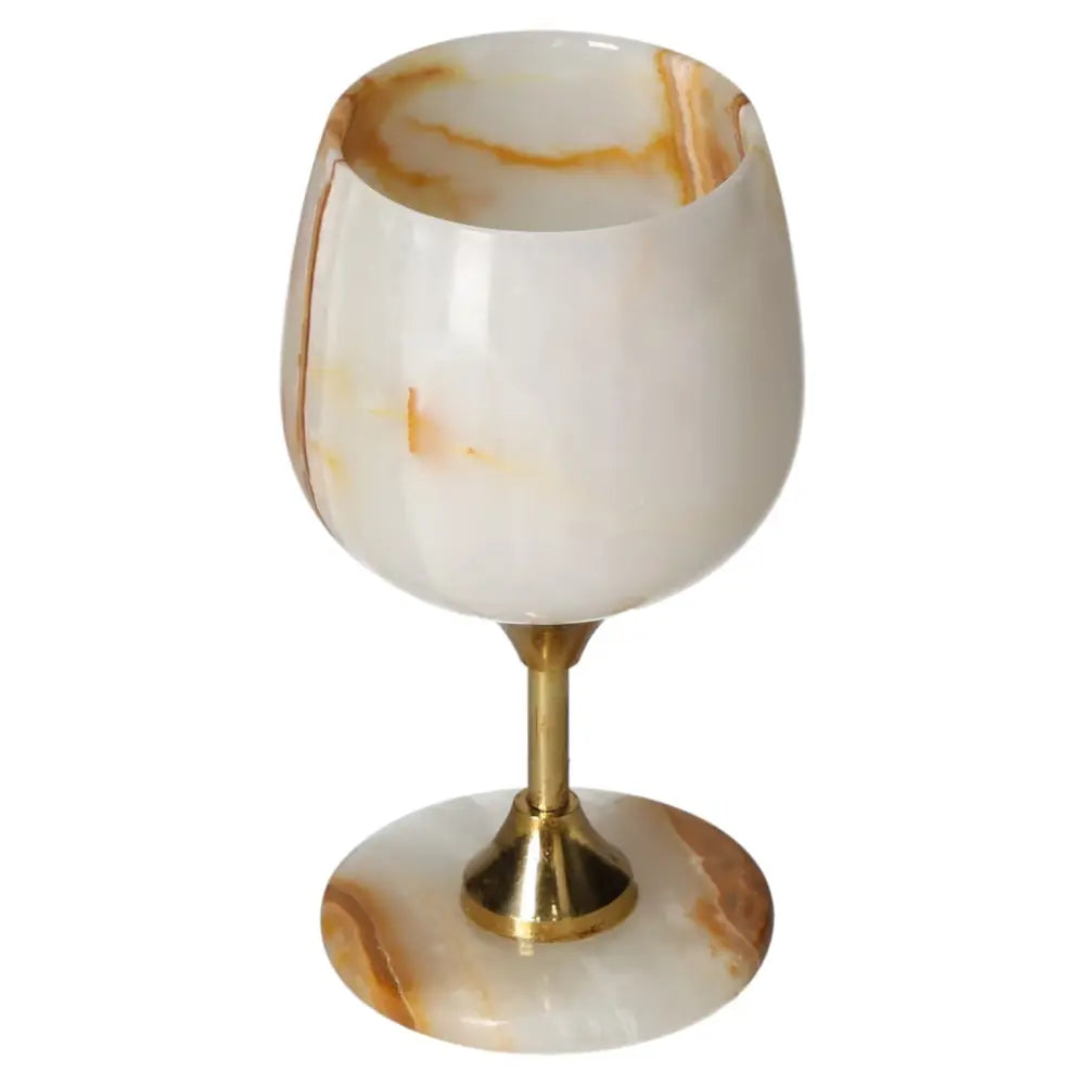 Elegant off-white onyx wine glass with natural veining and polished finish, showcasing exquisite craftsmanship and sophistication.