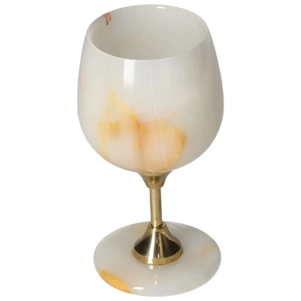 Elegant onyx wine glass with unique off-white and gold veining, featuring a smooth, polished surface and sophisticated design.