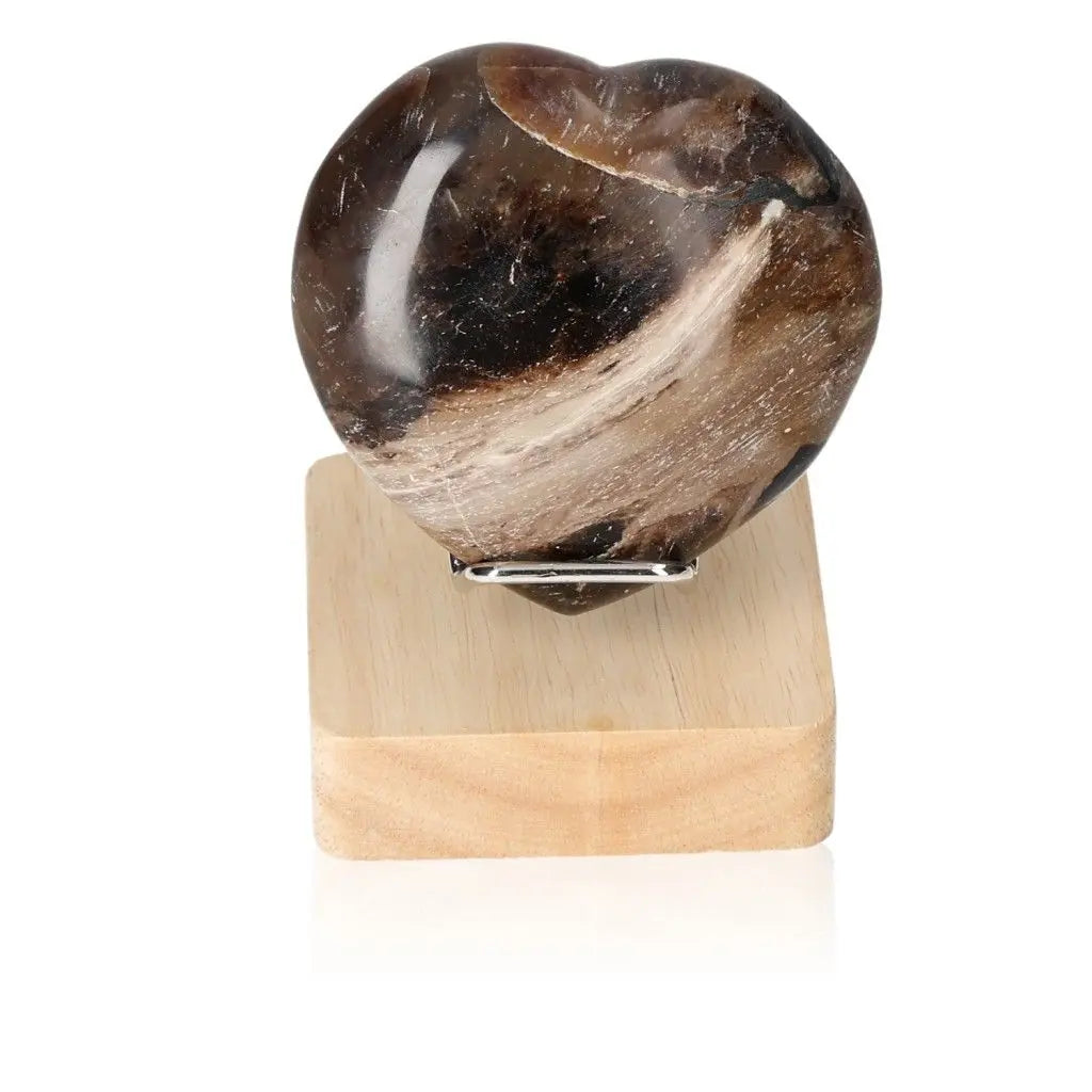 Opal Verte Heart crystal on wooden stand, showcasing its rare and mystical beauty, ideal for encouraging love and cosmic consciousness.