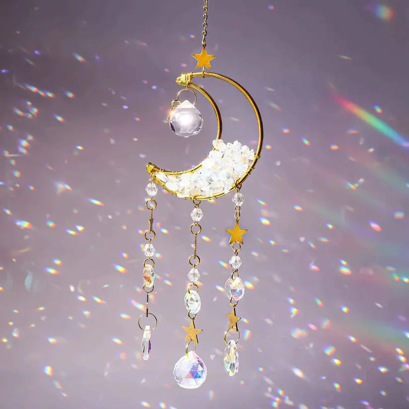 Opalite Moon Suncatcher casting rainbow prisms, symbolizing tranquility and balance with opalite crystals and star accents.