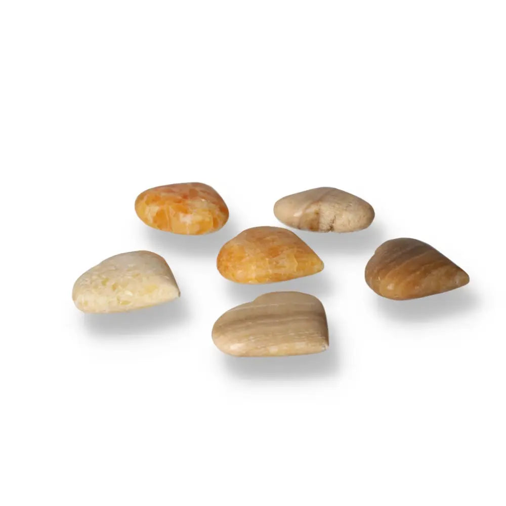 Heart-shaped orange calcite gemstones radiating warmth and energy, ideal for enhancing emotional balance and creativity.