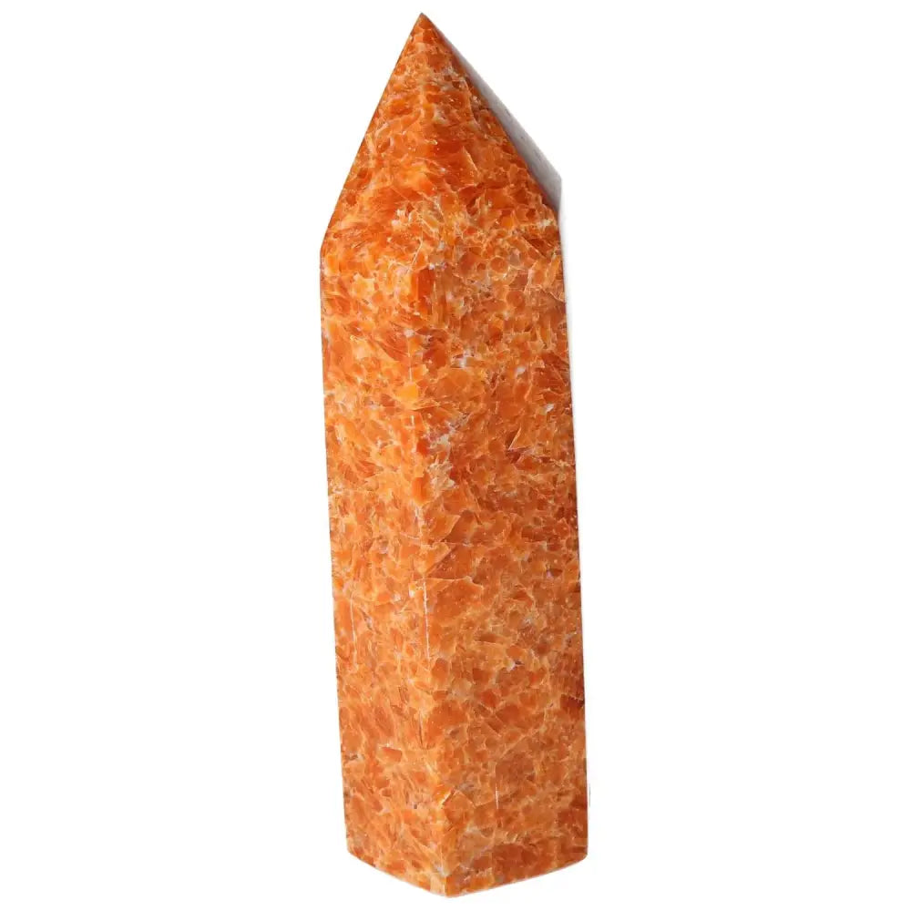 Orchid Calcite Obelisk with vibrant orange hues from Sylvia Crystals, showcasing polished surface for spiritual growth and grounding energy.
