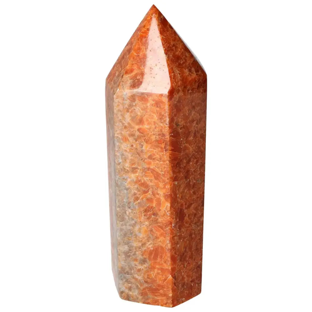 Orchid Calcite Obelisk by Sylvia Crystals featuring vibrant orange and peach hues, symbolizing clarity and spiritual growth.