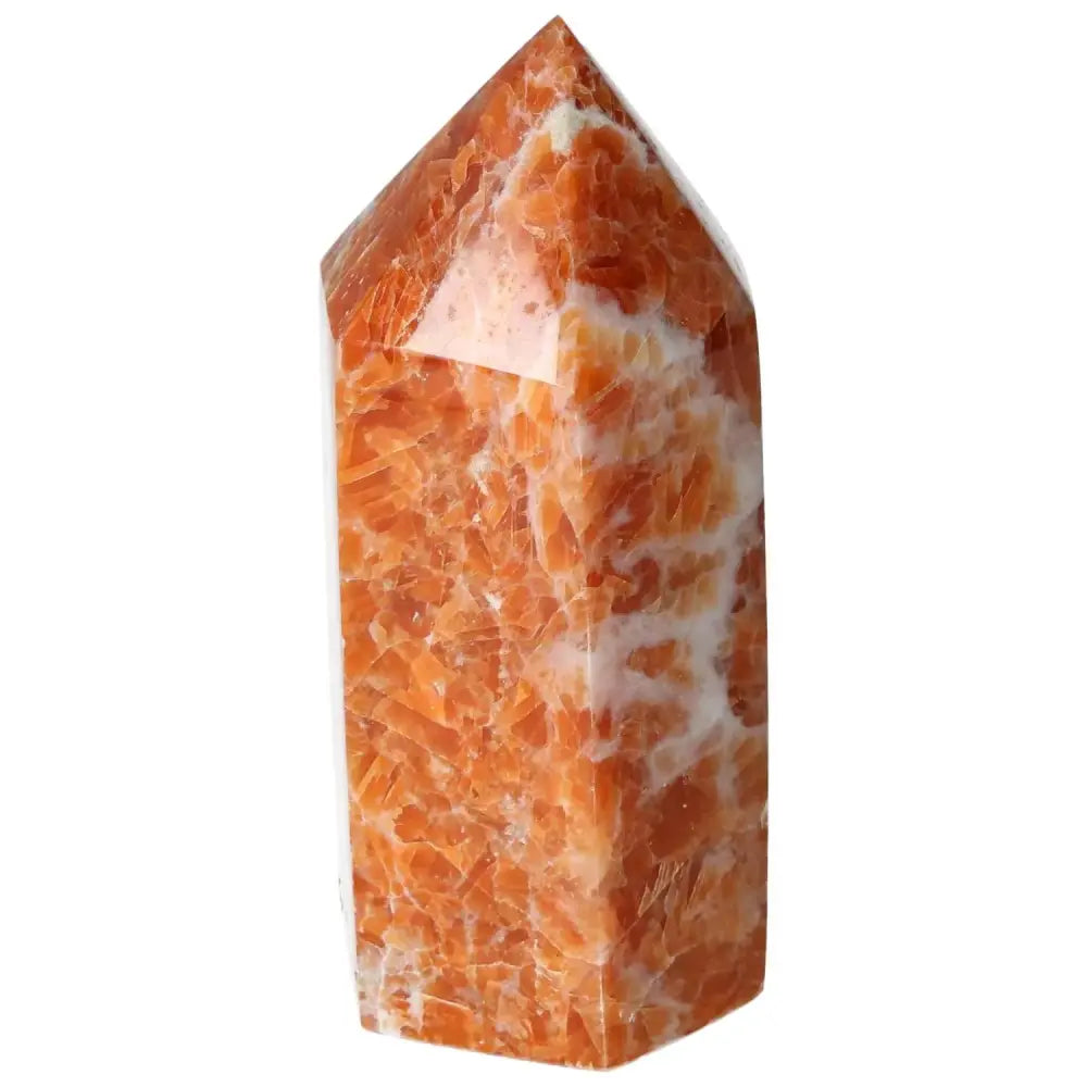 Orchid Calcite Obelisk from Sylvia Crystals featuring warm orange and peach hues with natural patterns, embodying strength and elegance.