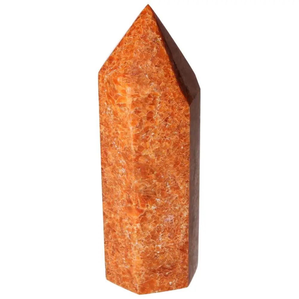 Orchid Calcite Obelisk by Sylvia Crystals, showcasing vibrant orange hues symbolizing clarity and spiritual growth.