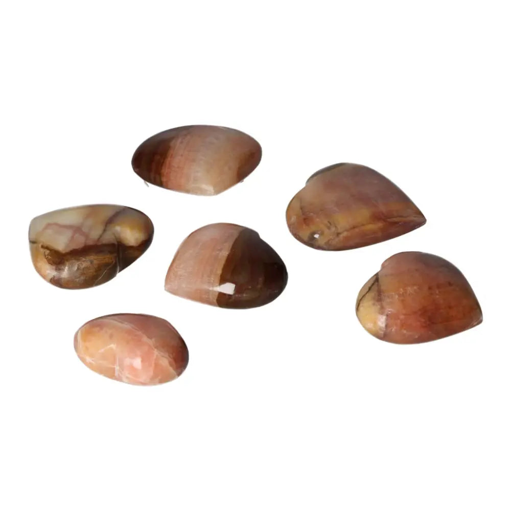Assorted peach calcite hearts, polished gemstones symbolizing love and emotional balance, perfect for crystal collections or gifts.
