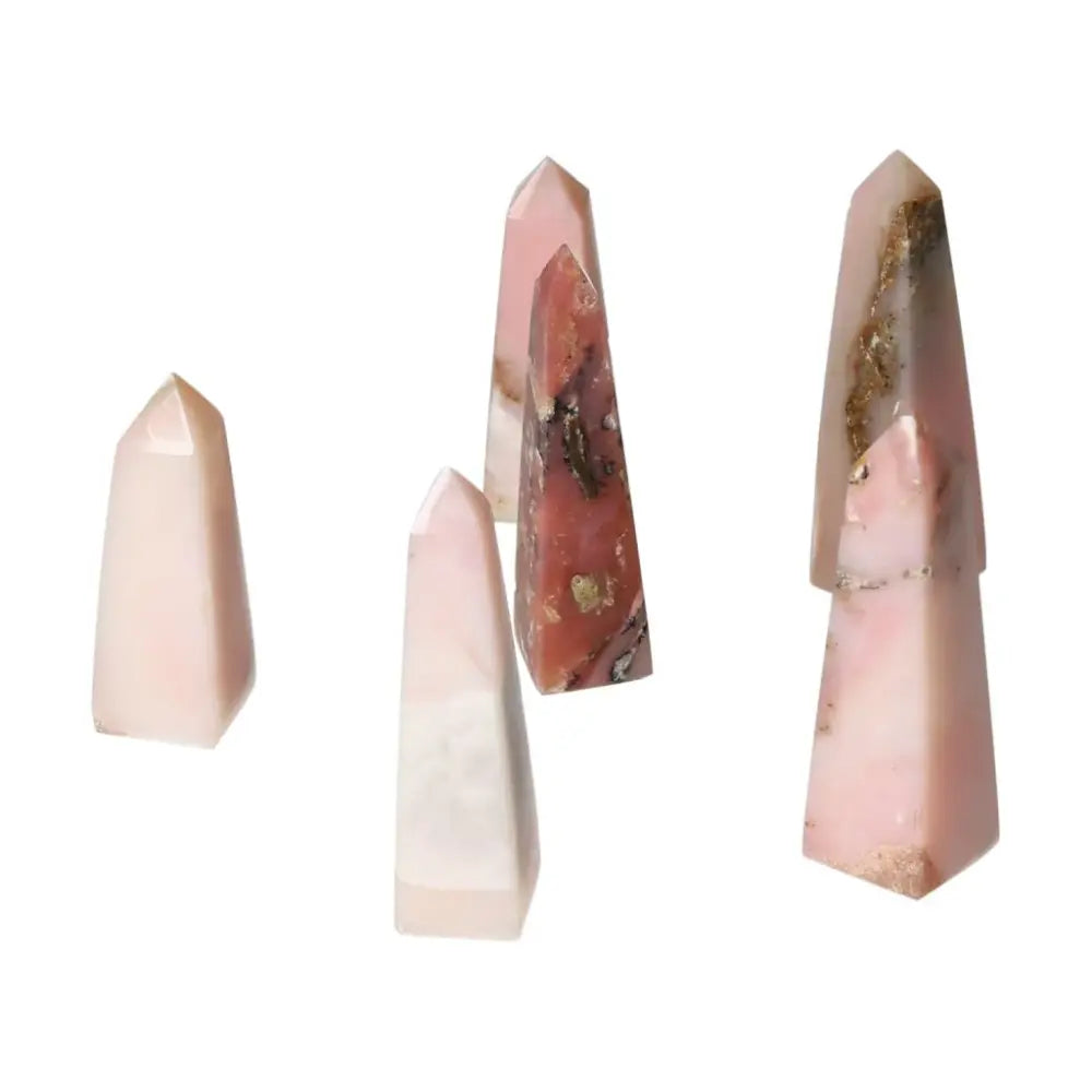Pink Opal towers featuring pastel pink hues and smooth, opalescent sheen, promoting emotional healing and personal transformation.