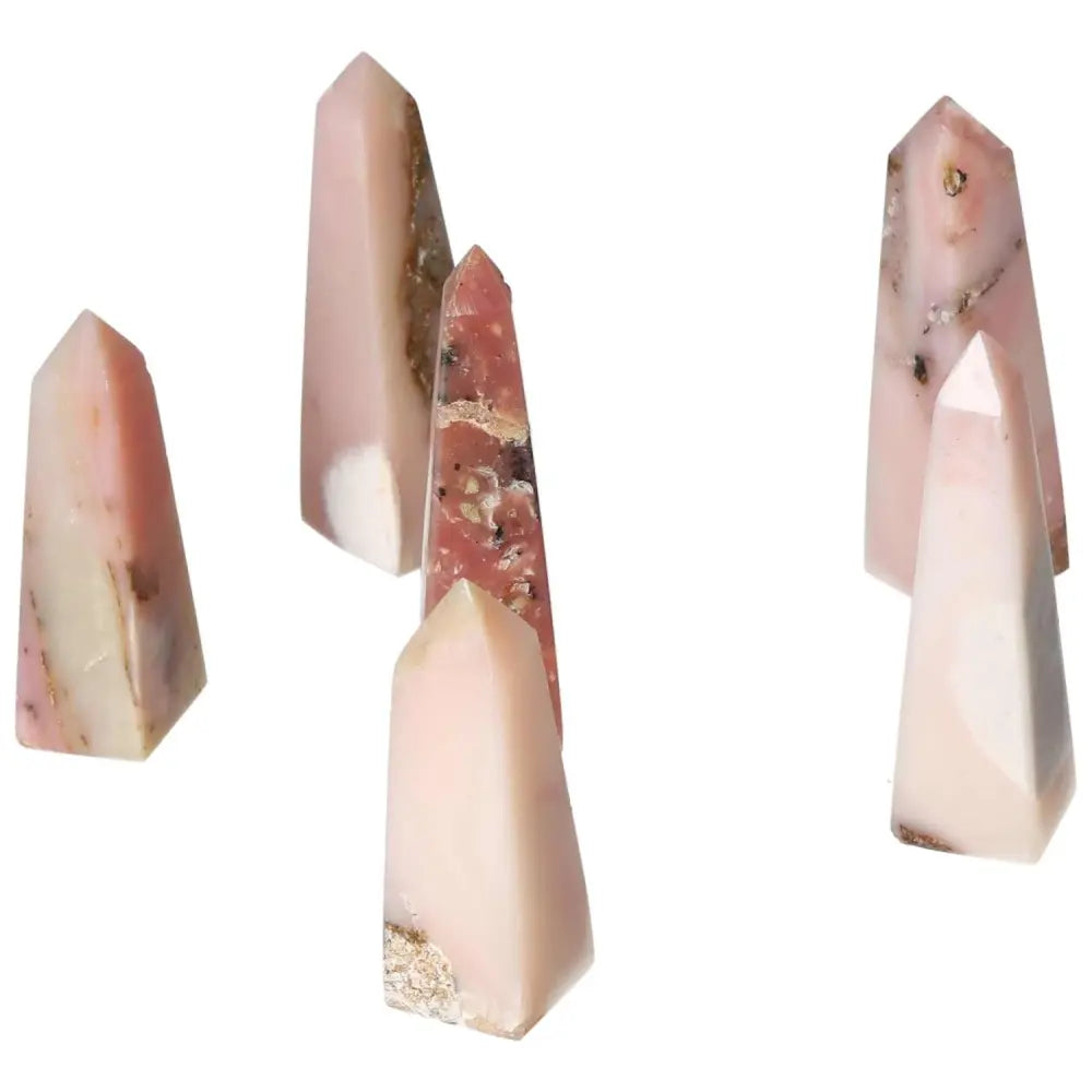 Group of Pink Opal Towers showcasing soft pastel pink hues, known for their calming energy and emotional healing properties.