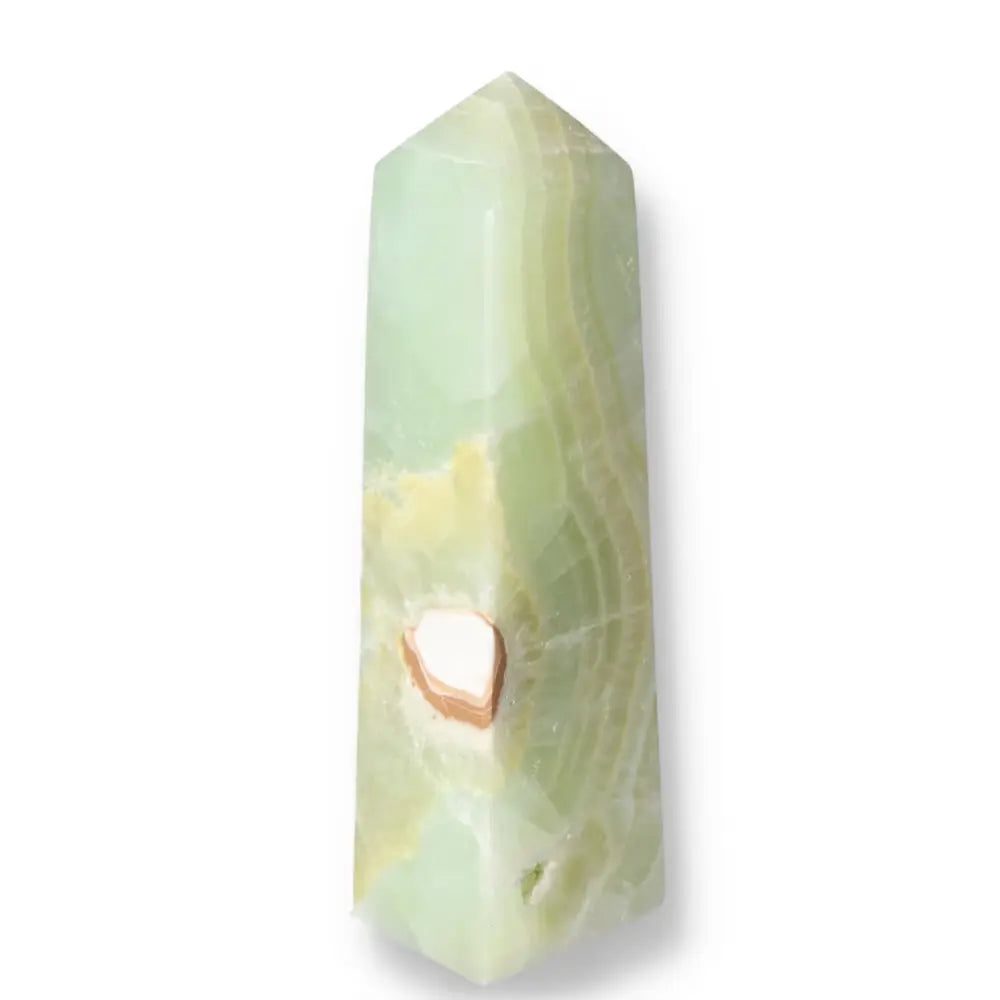 Pistachio Calcite Tower crystal featuring soothing green hues, promoting calm and harmony in any space.