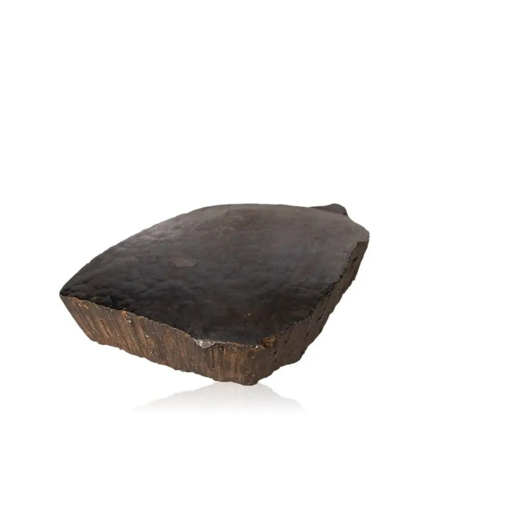 Polished botryoidal hematite crystal reflecting light, showcasing its shimmering metallic surface and grounding properties.