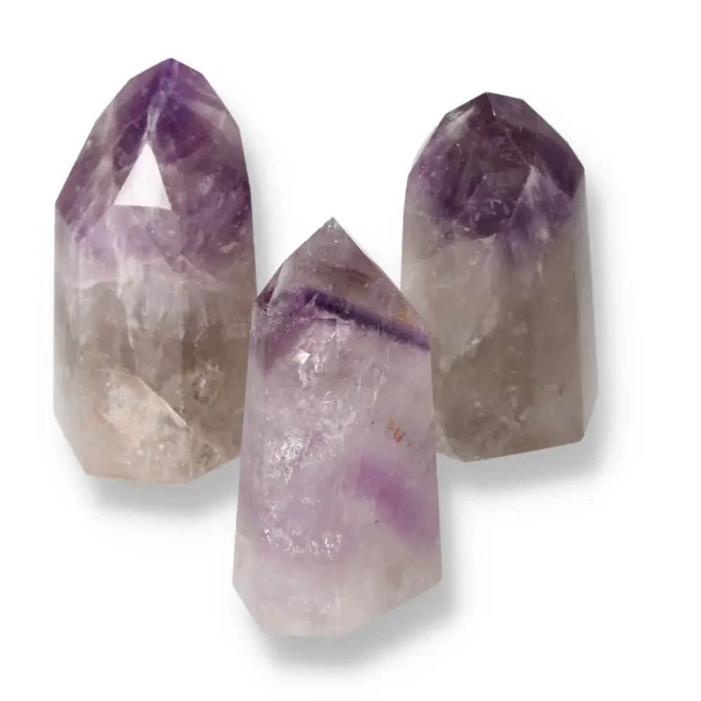 Polished Point Amethyst L crystals from Sylvia Crystals, showcasing premium craftsmanship and serene energy for stress reduction.