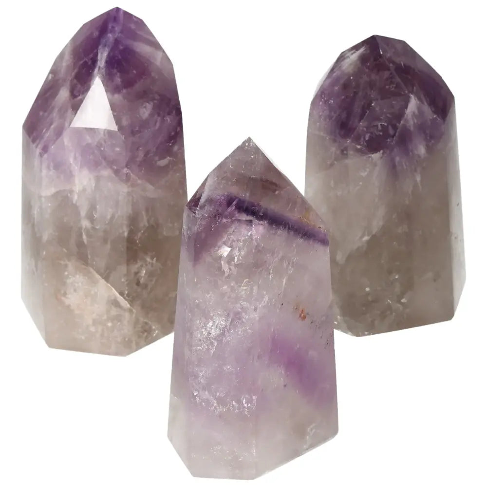 Polished Point Amethyst L crystals from Sylvia Crystals, showcasing premium craftsmanship and serene energy qualities. Stress-reducing amethyst.