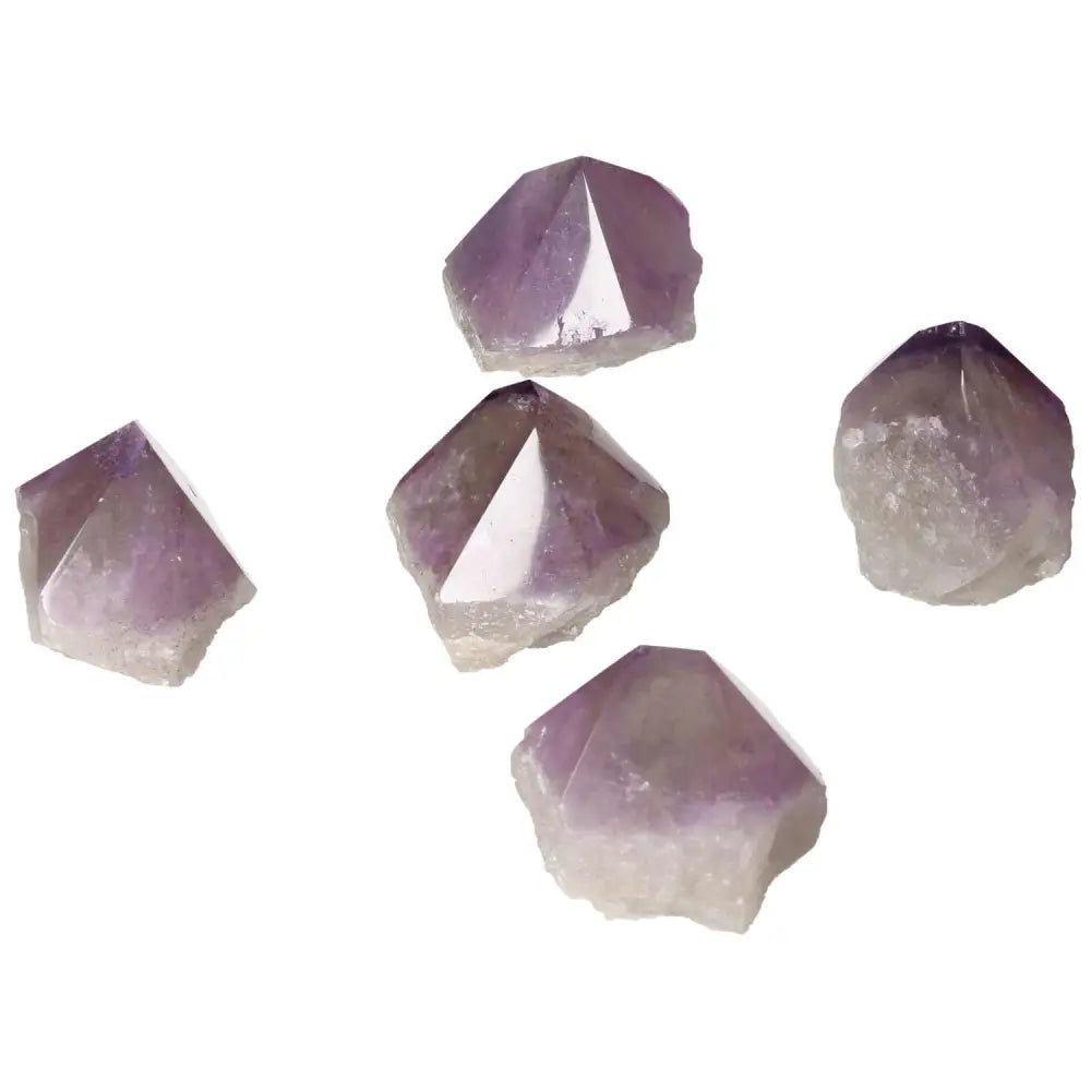 Five polished point amethyst stones by Sylvia Crystals, showcasing spiritual elegance and luxury.