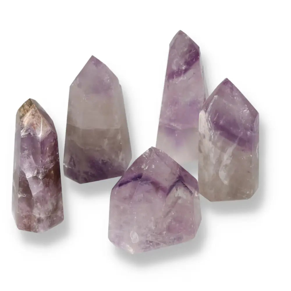 Polished Point Amethyst M stones showcasing their vibrant purple hues and unique crystal formations by Sylvia Crystals.