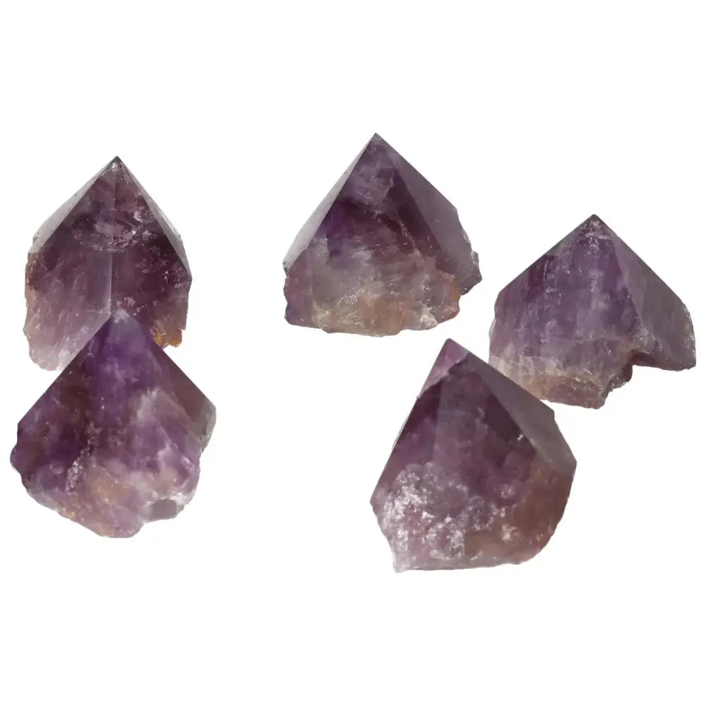 Collection of polished point amethyst crystals from Sylvia Crystals, enhancing well-being and energy, perfect for home décor.