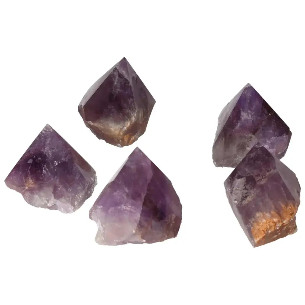 Polished Point Amethyst M crystals from Sylvia Crystals, showcasing premium quality and energy-enhancing properties.