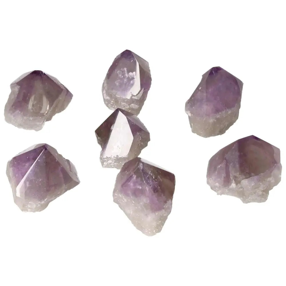 Seven polished amethyst crystals showcasing their vibrant purple hues, ideal for stress relief and enhancing concentration.