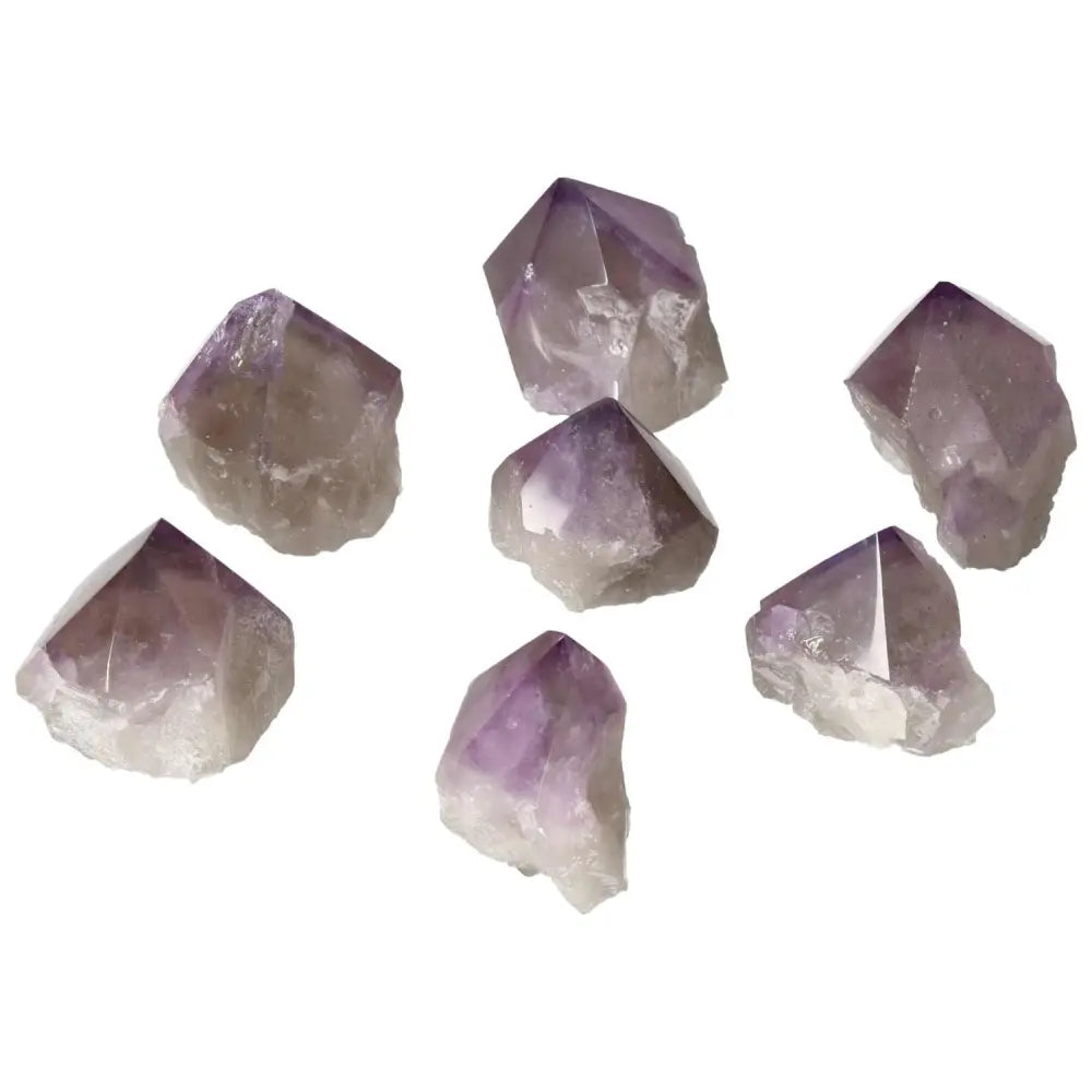 Polished amethyst points from Sylvia Crystals, promoting relaxation and focus with a touch of luxury and spiritual elegance.