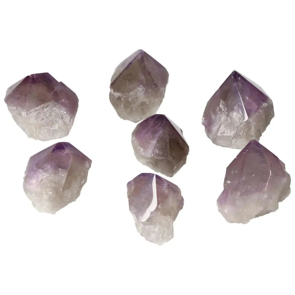 Polished Point Amethyst S clusters from Sylvia Crystals, showcasing premium quality and calming properties for stress relief and concentration.