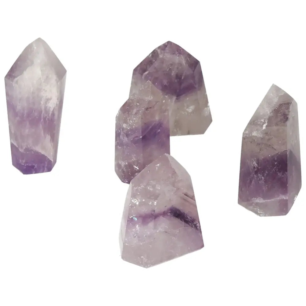 Polished Point Amethyst S gemstones, featuring violet hues, ideal for energy enhancement and decor, from Sylvia Crystals.