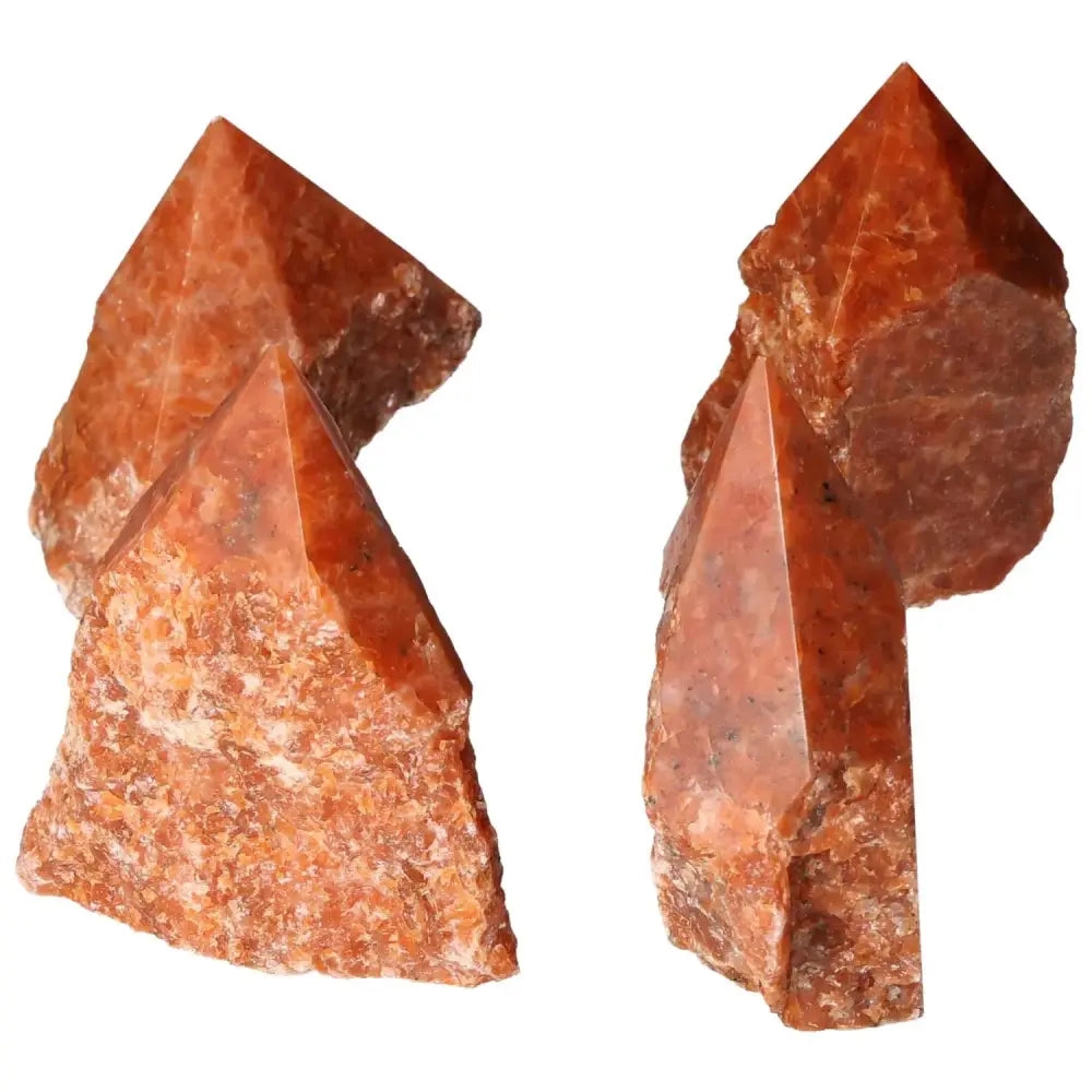 Polished Point Calcite L with vibrant orange and red hues from Sylvia Crystals, symbolizing willpower and vitality.