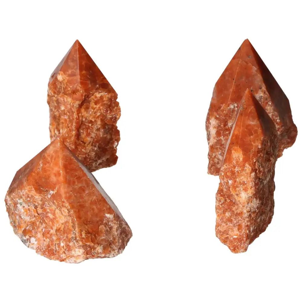Polished Point Calcite L crystals with vibrant orange hues, symbolizing willpower and vitality, from Sylvia Crystals.