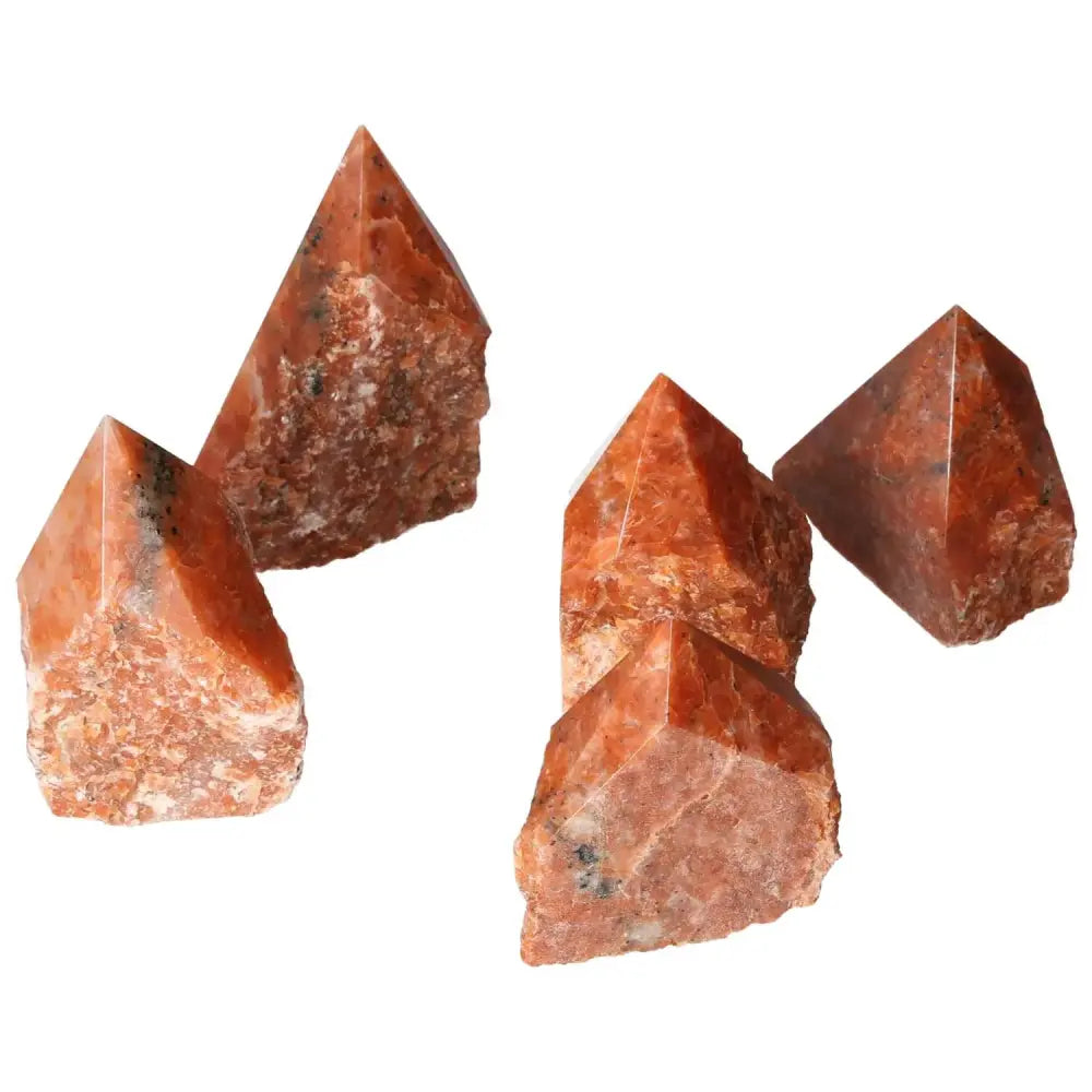 Polished Point Calcite M crystals from Sylvia Crystals, showcasing fiery tones for luxury and spiritual transformation.