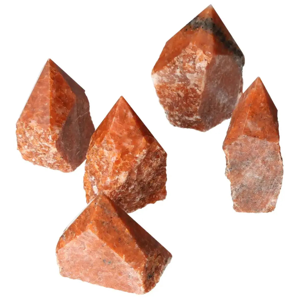 Polished Point Calcite M crystals from Sylvia Crystals, showcasing vibrant fiery tones, symbolizing willpower and personal transformation.
