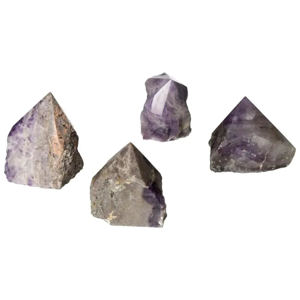Four polished Chevron Amethyst stones showcasing purple hues and unique patterns, known for metaphysical properties like stress reduction.