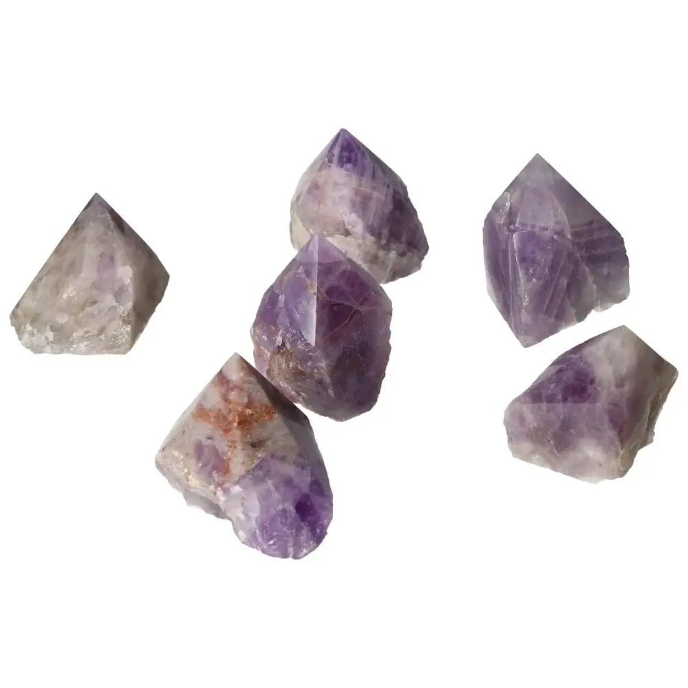 Polished Point Chevron Amethyst S gemstones with unique patterns, embodying healing and luxury, from Sylvia Crystals.