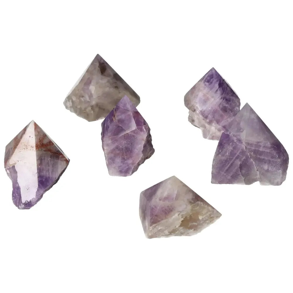 Polished Point Chevron Amethyst S gemstones showcasing unique chevron patterns from Sylvia Crystals.