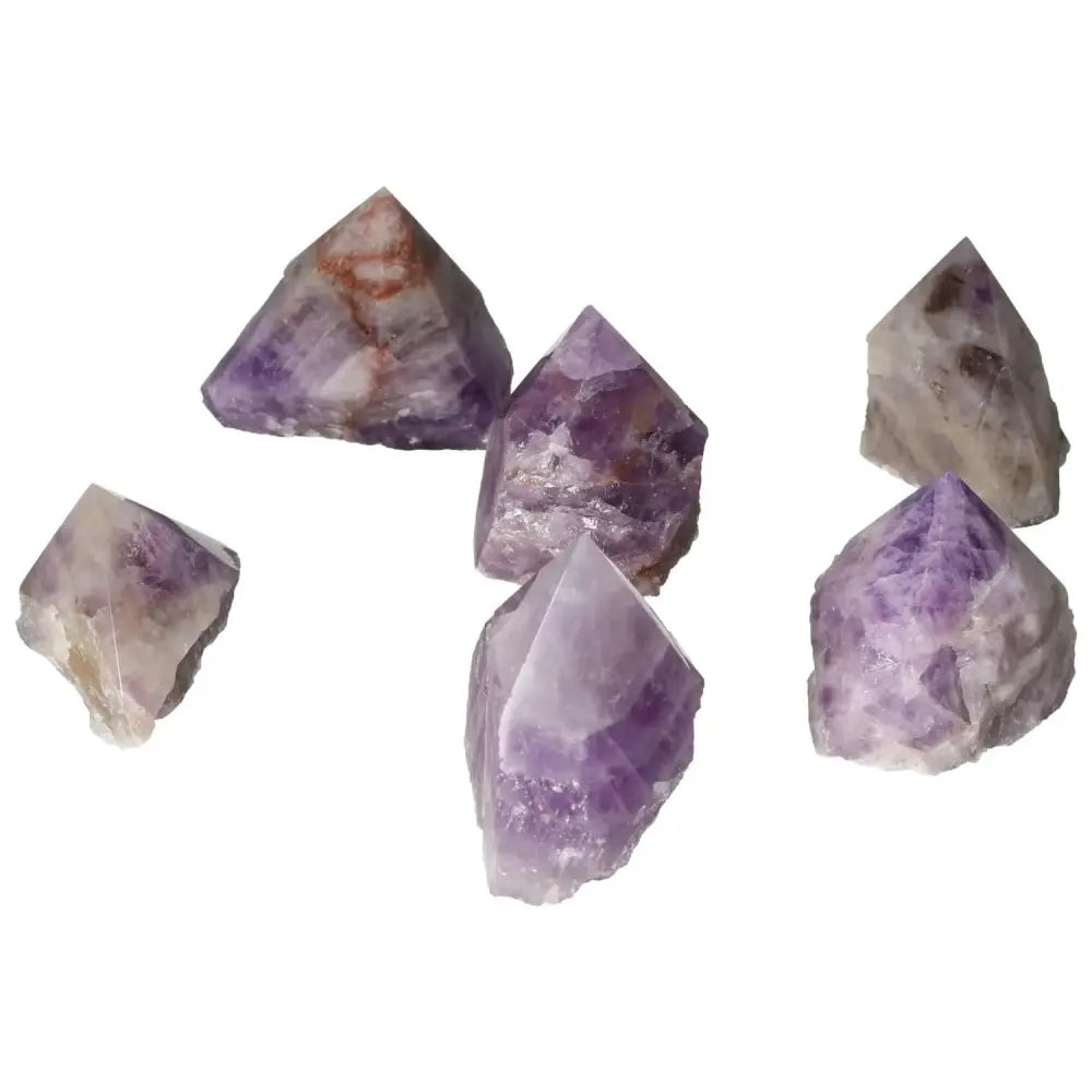 Collection of Polished Point Chevron Amethyst S gemstones showcasing unique chevron patterns and luxurious quality from Sylvia Crystals.