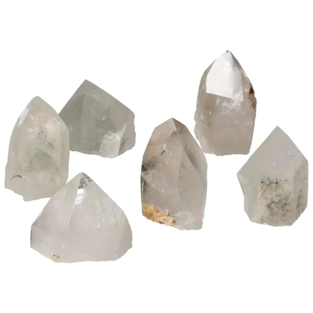 Polished point clear quartz crystals with chlorite from Sylvia Crystals, showcasing unique energy-enhancing and purifying properties.